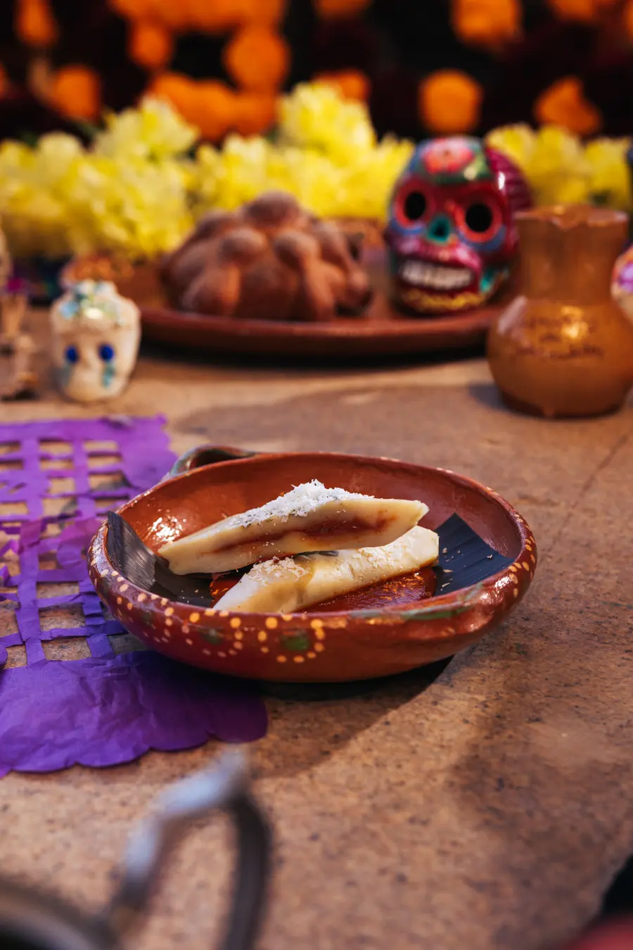 Heirloom corn tamalito in a clay dish