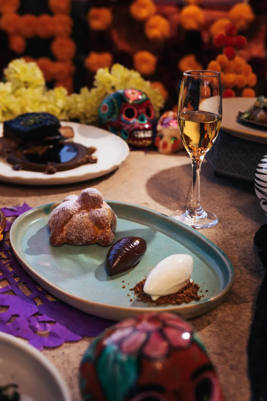 Handmade pan de muerto with chocolate and milk ice cream